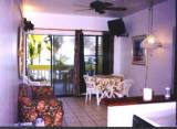 View of living room toward oceanfront balcony